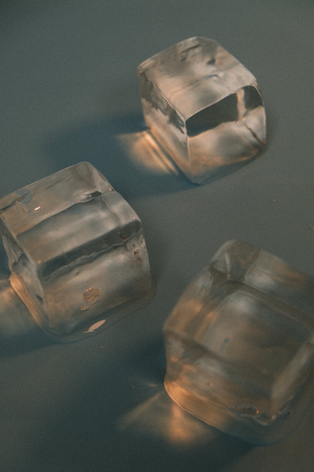 Stacked clear cocktail ice cubes.